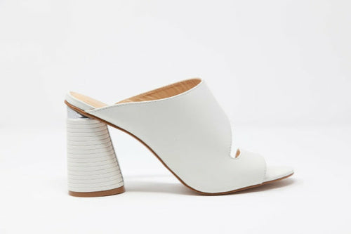 Apricot Hercules Melanie heels with stylish design, featuring pointed toes and ankle straps, shown on a neutral background.