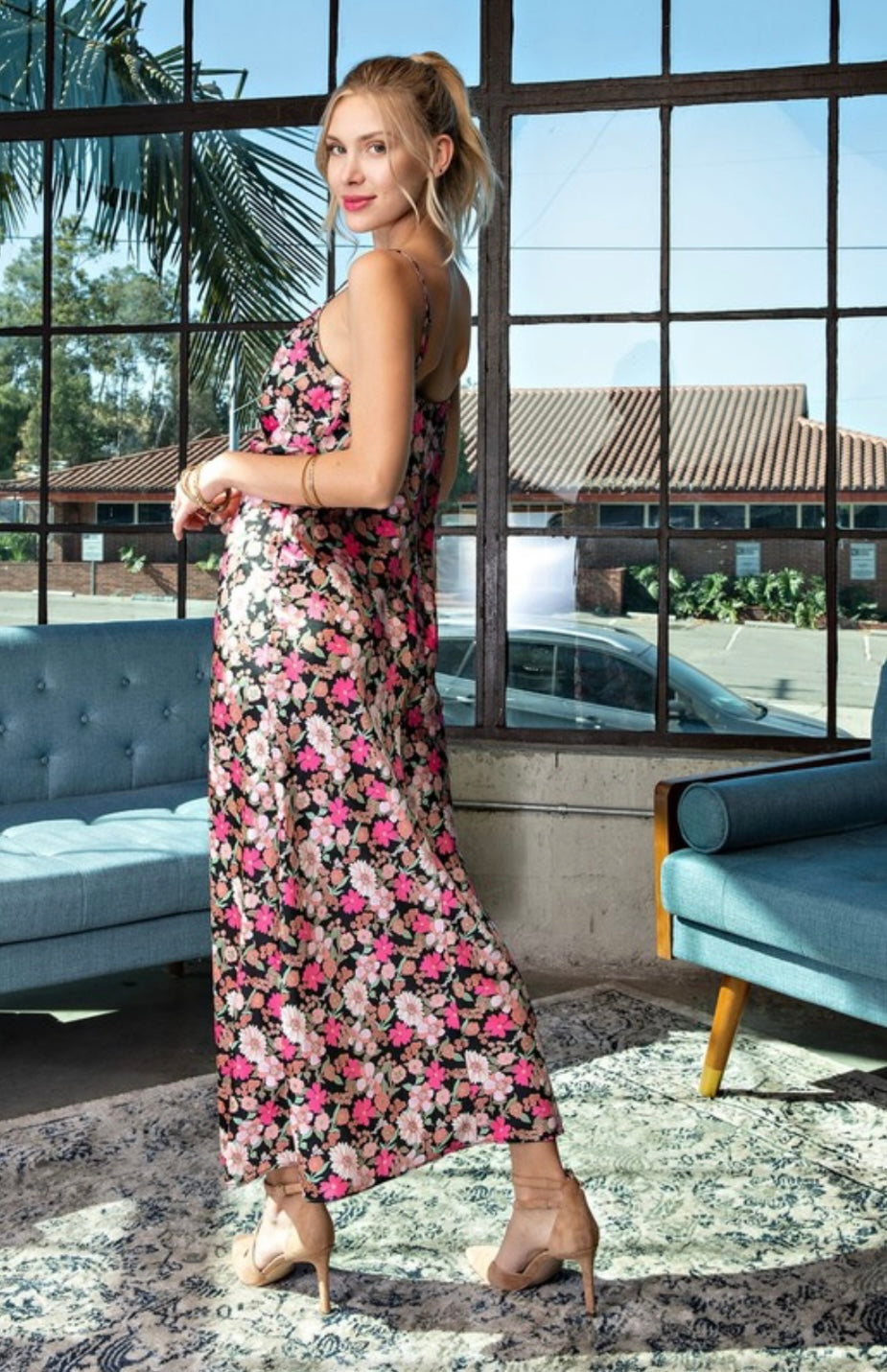Carmine Pontus Serena Floral Maxi Dress for women, featuring a vibrant floral pattern and flowing fabric.