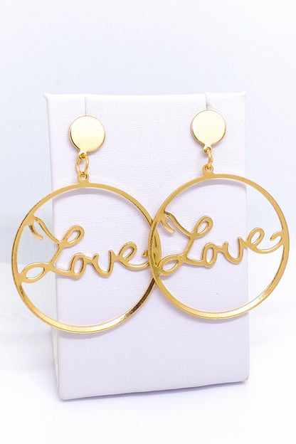 Burgundy Uranus Love Earrings with gold-toned hoops featuring heart-shaped design on a white background