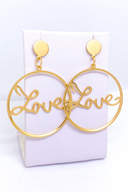 Burgundy Uranus Love Earrings hoops with heart-shaped design, gold-tone metal, and polished finish on a plain white background.