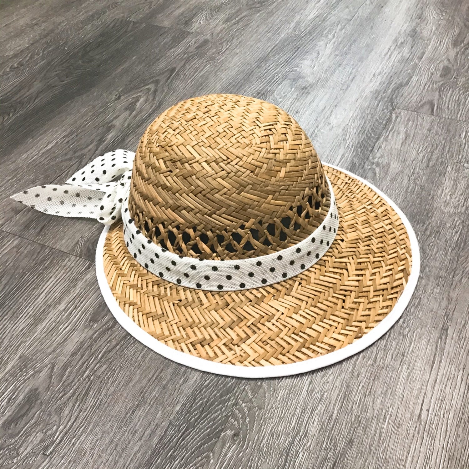 Violet Medea polka dot bow straw visor hat with wide brim, perfect for sun protection and stylish summer wear.