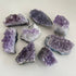 Amethyst clusters for home decor by Taupe Poseidon, featuring vibrant purple crystals arranged as natural mineral formations.