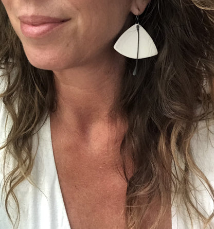 Handmade hypoallergenic lightweight ceramic statement earrings by Azure Nesoi, featuring sleek modern design and vibrant colors.