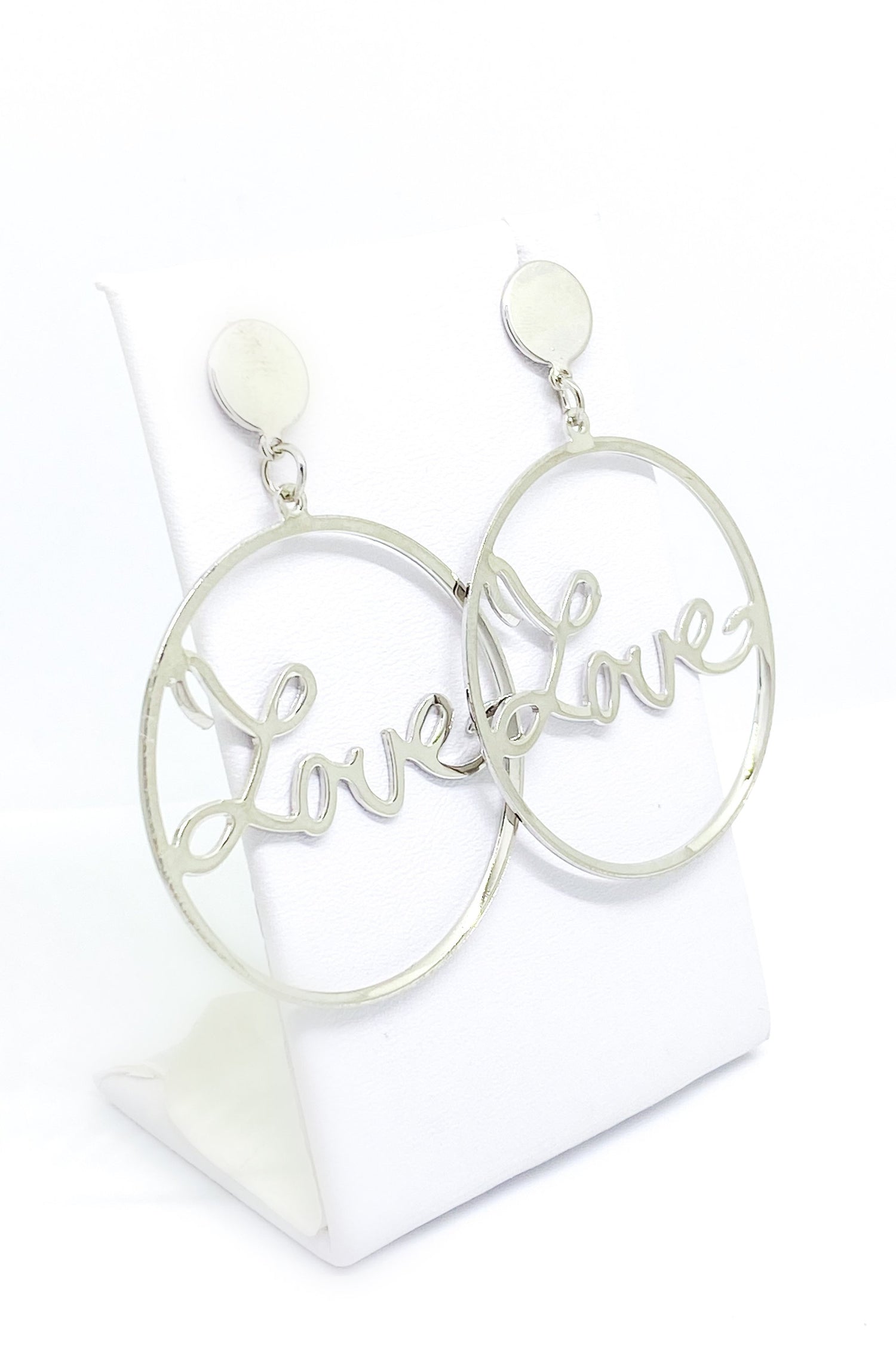 Burgundy Uranus Love Earrings, stylish hoop earrings with heart-shaped design, made of shiny metallic material.
