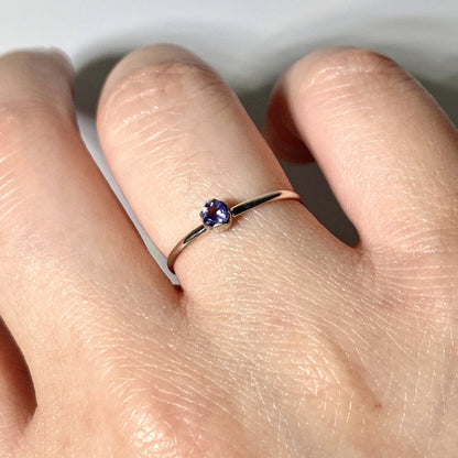 Sterling silver dainty ring featuring a solitaire iolite gemstone, showcasing elegant jewelry design by Grey Clymene.