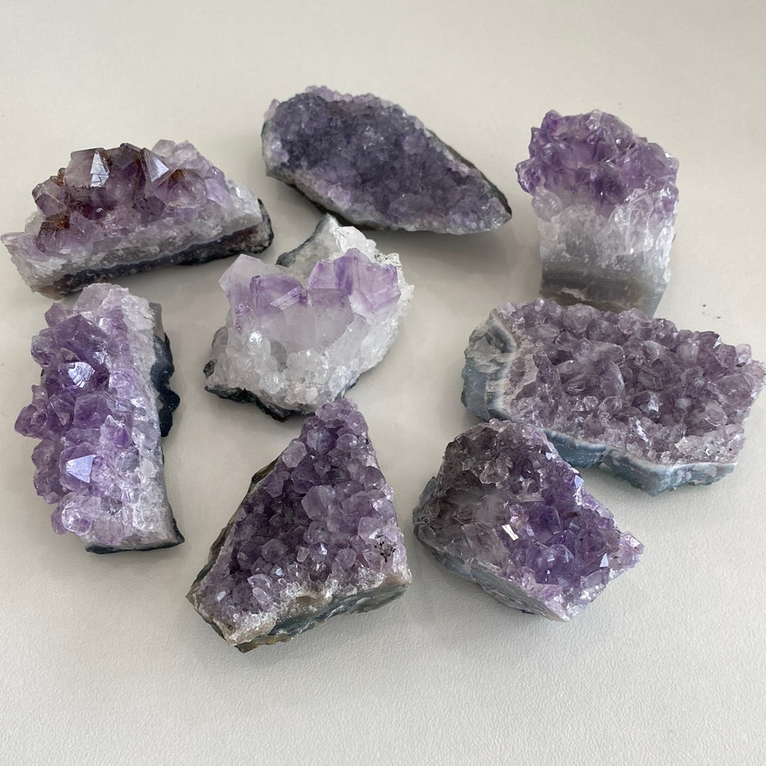 Taupe Poseidon amethyst clusters for home decor, featuring vibrant purple crystals and natural mineral formations.