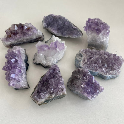 Taupe Poseidon amethyst clusters for home decor, featuring vibrant purple crystals and natural mineral formations.