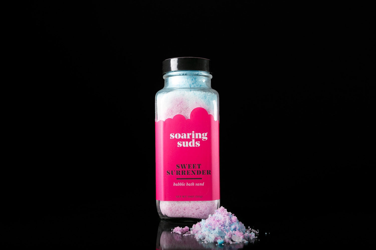 Salmon Uranus Sweet Surrender Bubble Bath Sand in a jar, showcasing colorful bath salts for a relaxing bath experience.
