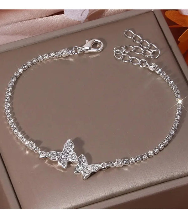 Purple Windroot double butterfly rhinestone bracelet with sparkling butterfly charms and silver-tone chain jewelry.
