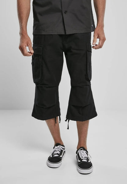 Callisto Industry 3/4 Cargo Shorts with multiple pockets, made from durable fabric, shown in a casual outdoor setting.
