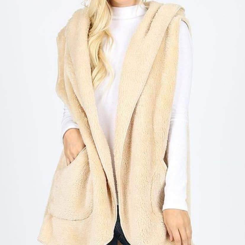 Ivory fleece hooded vest for women by Ochre Ismene, featuring a cozy, soft fleece fabric and a stylish hood design.
