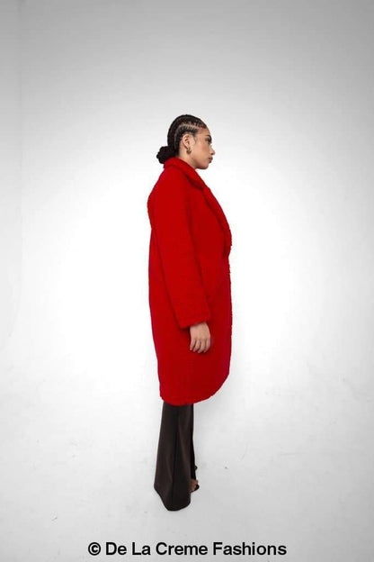 Rose Eleusis Jackie double-breasted borg teddy midi coat displayed on a hanger, showcasing its cozy fleece texture and classic design.