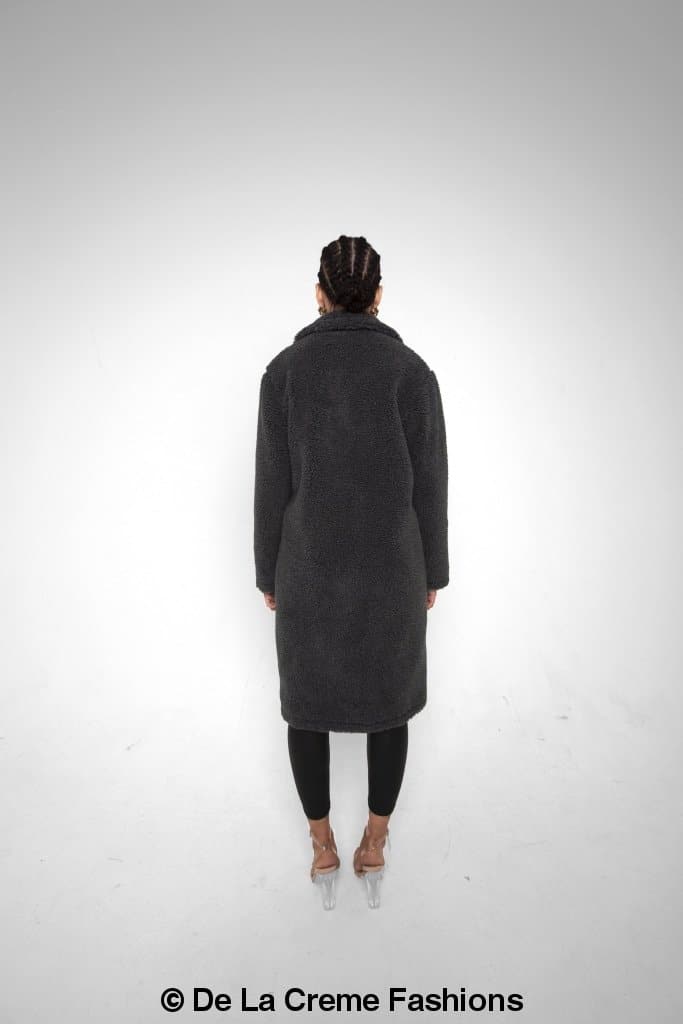 Rose Eleusis Jackie double-breasted borg teddy midi coat displayed on a hanger, showcasing plush, warm winter jacket with button details.