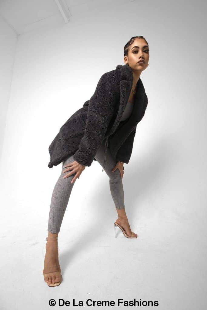 Rose Eleusis Jacqueline oversized teddy coat in beige, soft plush fabric, displayed on a hanger against a neutral background.