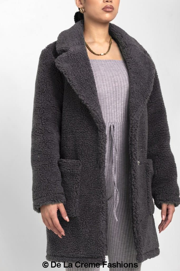 Rose Eleusis Jacqueline oversized teddy coat shown in a cozy, plush beige jacket with a relaxed fit and large collar.