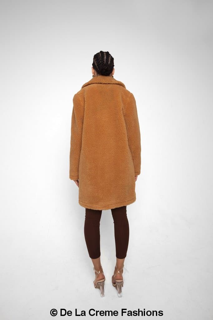 Rose Eleusis Jacqueline oversized teddy coat on a hanger, featuring plush fabric and cozy design, perfect for winter jackets and coats.