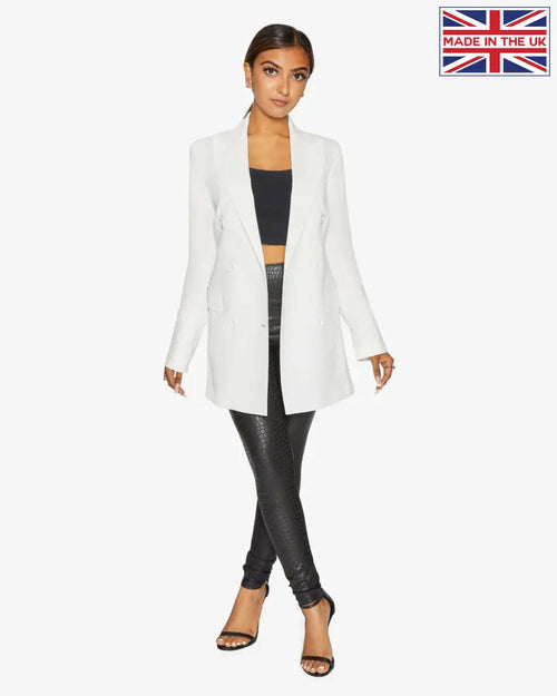 White Jenna double-breasted blazer by Rose Eleusis, tailored fit with lapels and button details, shown on a hanger.