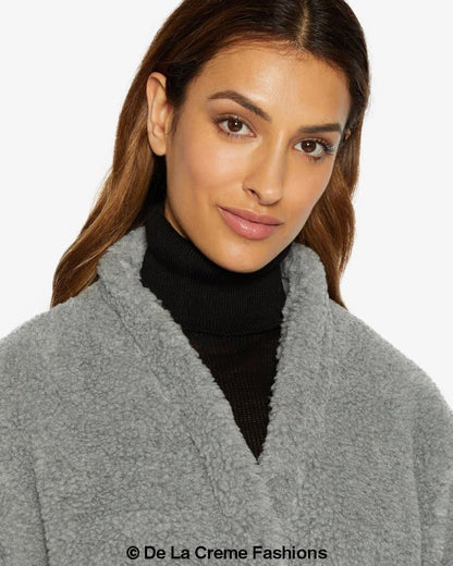 Jenna wearing Rose Eleusis open front belted teddy coat with a soft, plush fabric and relaxed fit in a cozy jacket style.