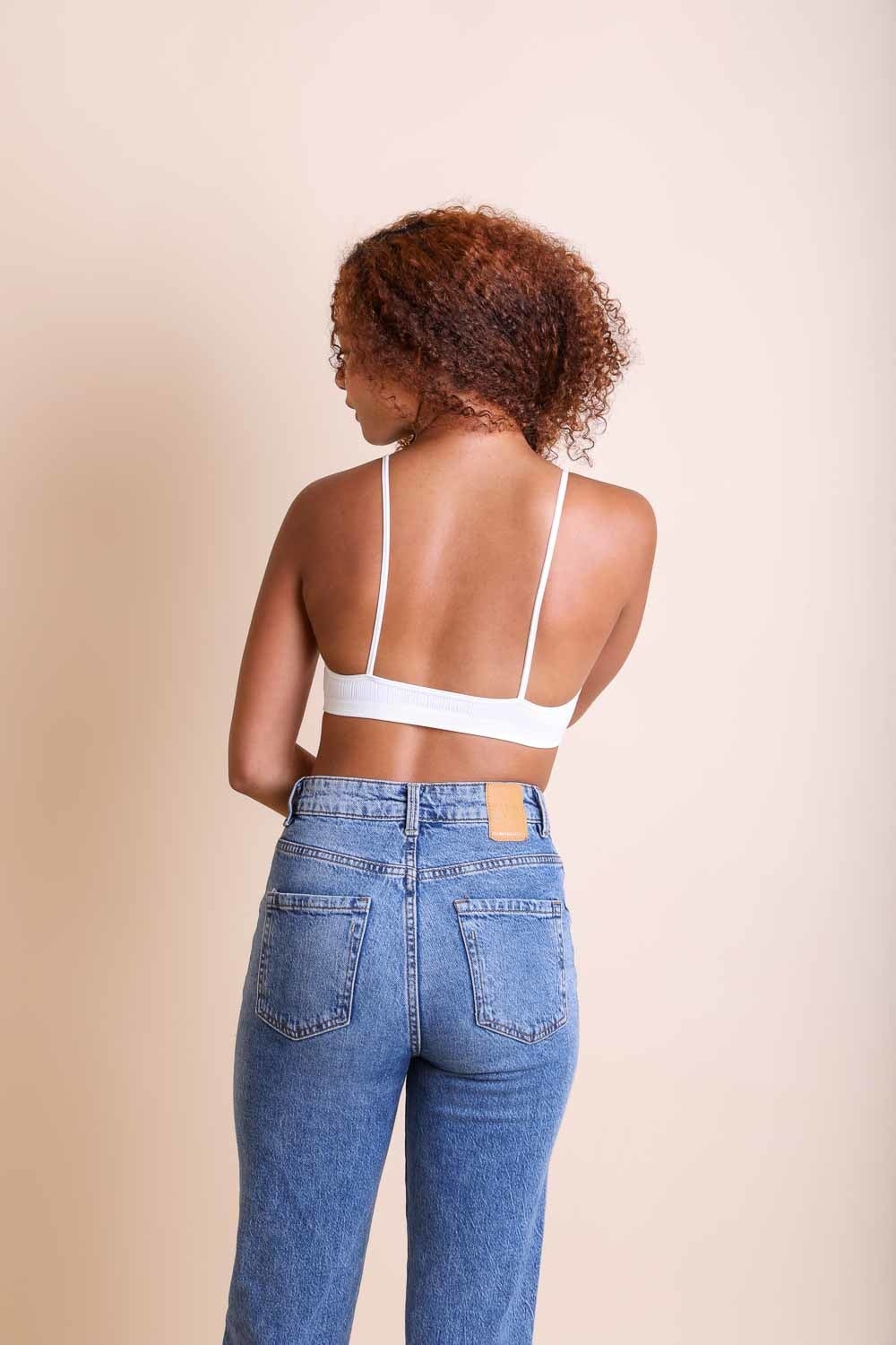 Periwinkle Aether Kali Cross Plunge Bralette from the Leto Collection, featuring a stylish, strappy design and soft fabric.