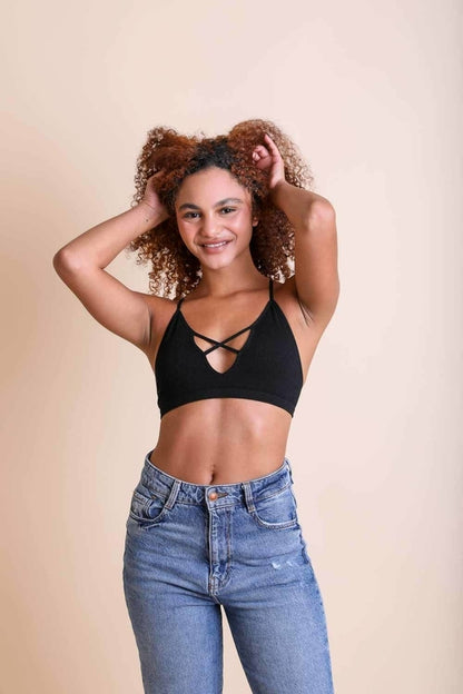Periwinkle Aether Kali Cross Plunge Bralette in black from the Leto Collection, featuring a plunging design and adjustable straps.