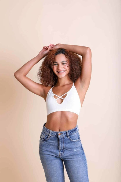 White Kali Cross Plunge Bralette from Periwinkle Aether, featuring a delicate cross design and soft, comfortable fabric.