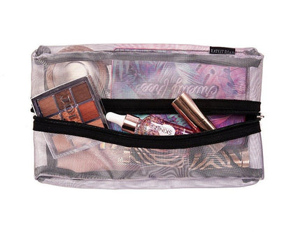 Silver mesh makeup case by Erin Crius, featuring a compact, breathable design with a zipper closure and multiple compartments.