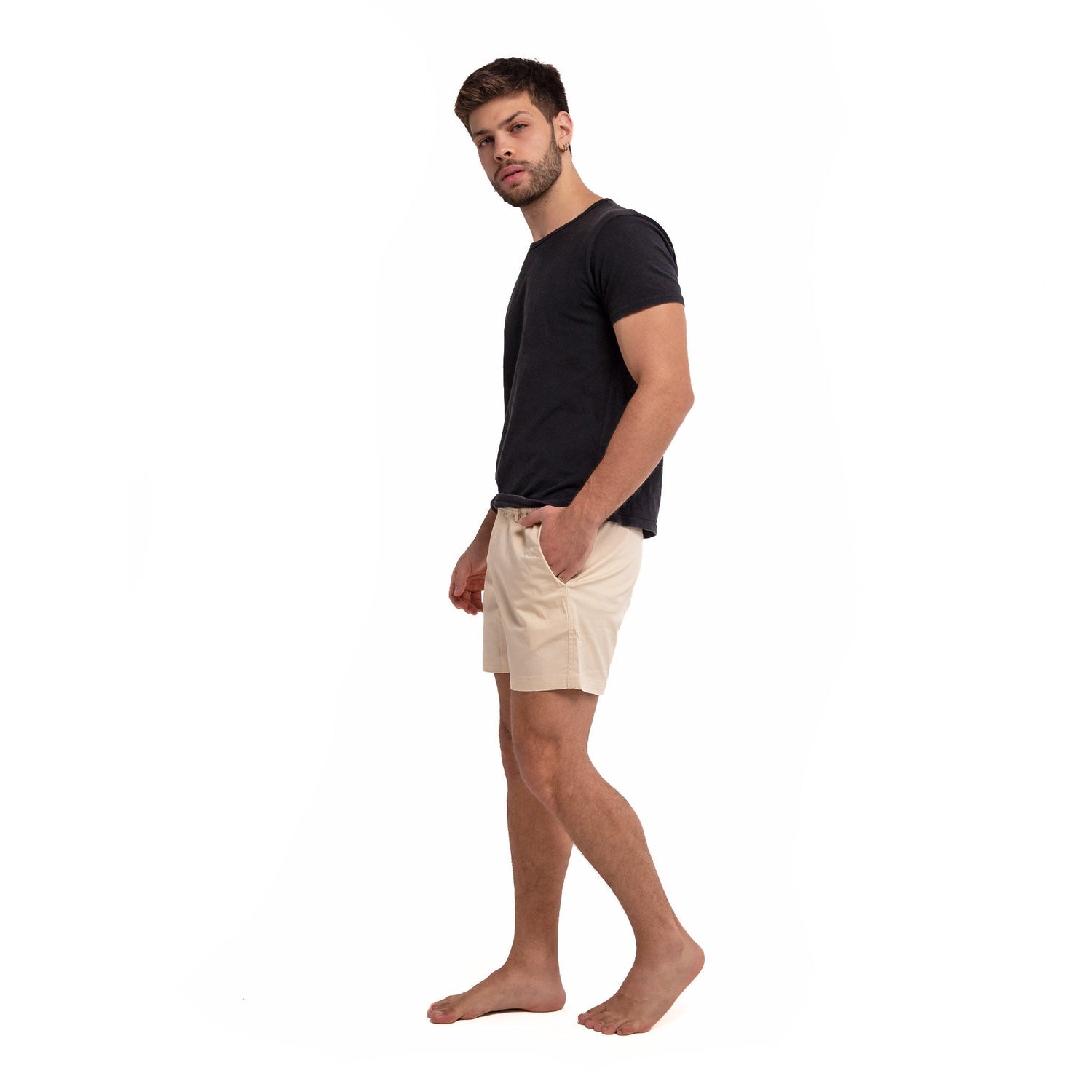 Khaki cotton swim shorts by Ruby Tartarus with a relaxed fit and adjustable waistband, displayed flat on a plain background.