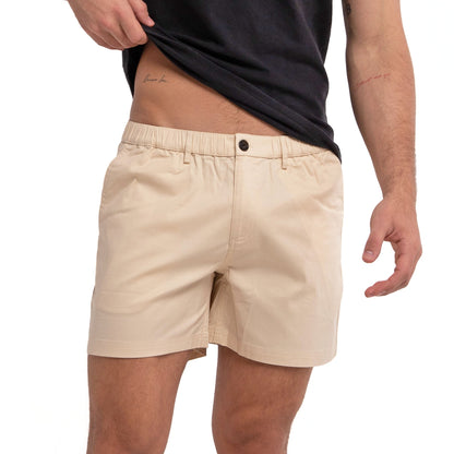 Khaki cotton swim shorts by Ruby Tartarus, featuring a relaxed fit and casual style, shown on a model.