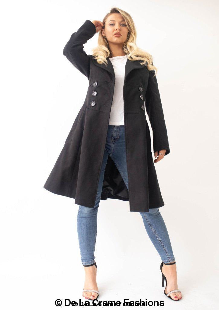 Rose Eleusis Kirsty slim fit A-line coat hanging on a wooden hanger, showcasing tailored design and classic style.