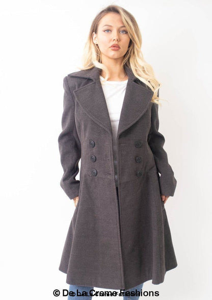 Rose Eleusis Kirsty Slim Fit A-Line Coat hanging on a clothing rack, showcasing its tailored fit and classic design.