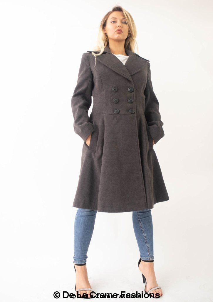Grey Kirsty Slim Fit A-Line Coat by Rose Eleusis hanging on a coat rack, showcasing its tailored silhouette and classic design.