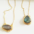 Violet Baobab Agadir Labradorite pendant featuring a polished blue-green labradorite gemstone on a silver chain.