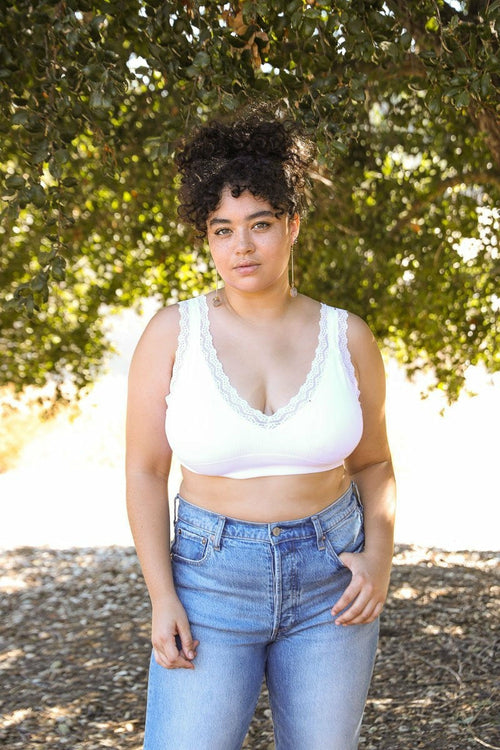 White lace-trimmed padded bralette from Periwinkle Aether, featuring delicate lace details and comfortable design.
