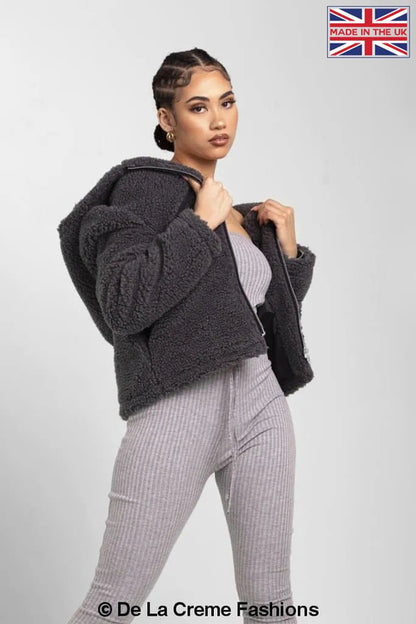 Rose Eleusis Lauren zip-up hooded borg teddy jacket in grey, featuring a cozy fleece-lined design and front zipper closure.