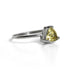 Sterling silver Lemon Topaz trillion solitaire ring by Grey Clymene, showcasing a vibrant yellow gemstone set in a sleek band.