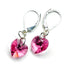 Sterling silver pink crystal heart earrings by Blue Crius, featuring delicate heart-shaped pink crystals on elegant silver hooks.