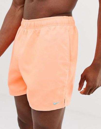 Light orange swim shorts from Sky Felix featuring a casual fit, displayed on a plain background.