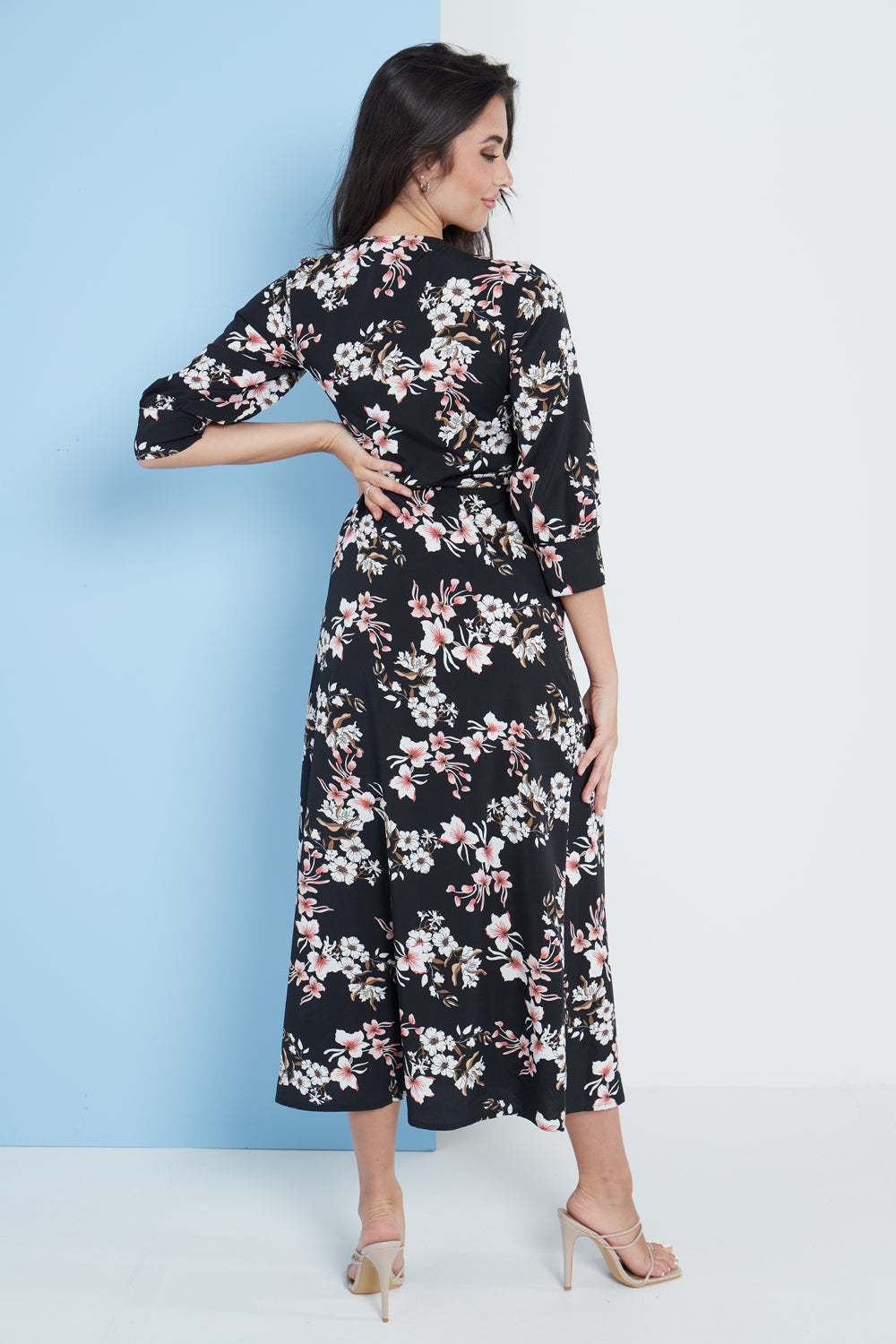 Black floral print midi wrap dress for women by Amethyst Millie, featuring a stylish and elegant design.