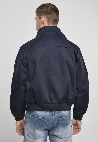 Light Norvine Harrington Canterbury jacket for men by Callisto, shown in natural outdoor setting with zipper and collar detail.