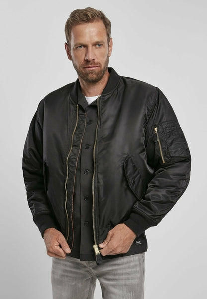 Callisto MA1 bomber jacket with heavy-duty fabric, shown in a close-up of the stylish black jacket with front zipper and ribbed collar.