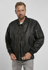 Callisto MA1 bomber jacket with heavy-duty fabric, shown in a close-up of the stylish black jacket with front zipper and ribbed collar.
