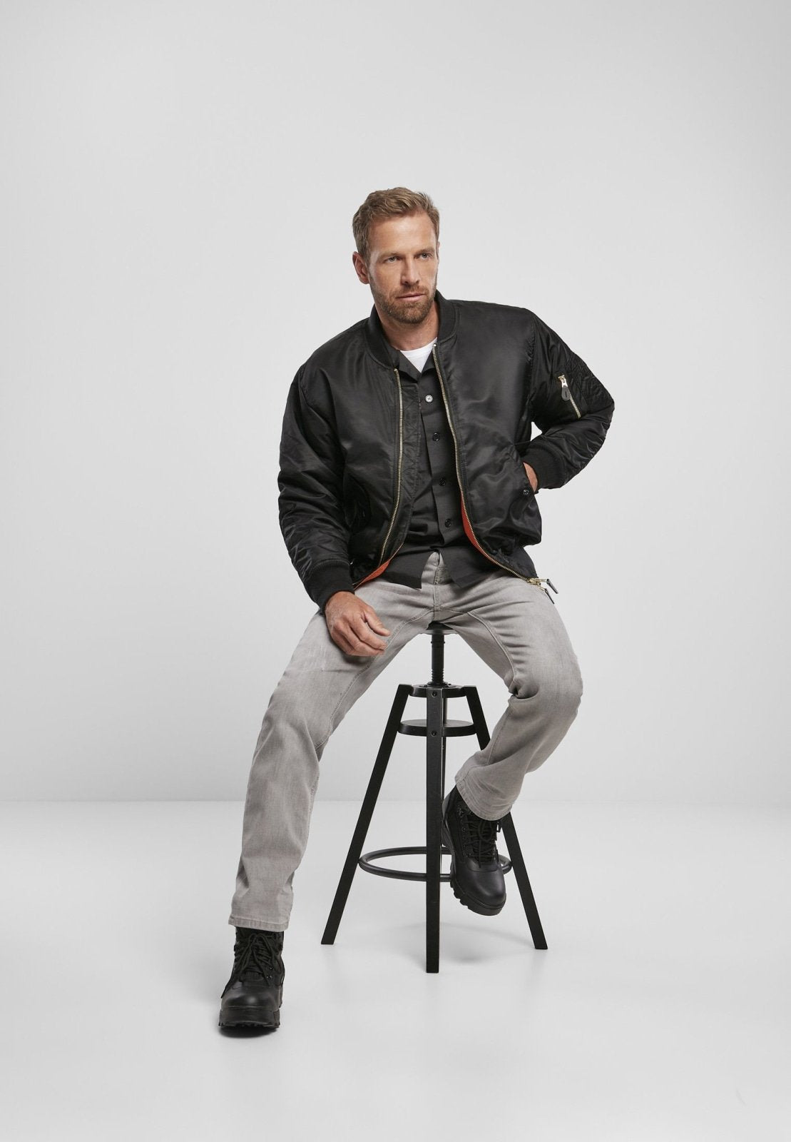 Callisto MA1 bomber jacket in navy, featuring ribbed cuffs and collar, with front zipper and multiple pockets.