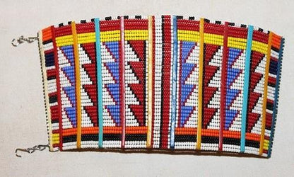 Colorful Maasai beaded traditional bracelet by White Baobab featuring vibrant ethnic beadwork on a woven band.