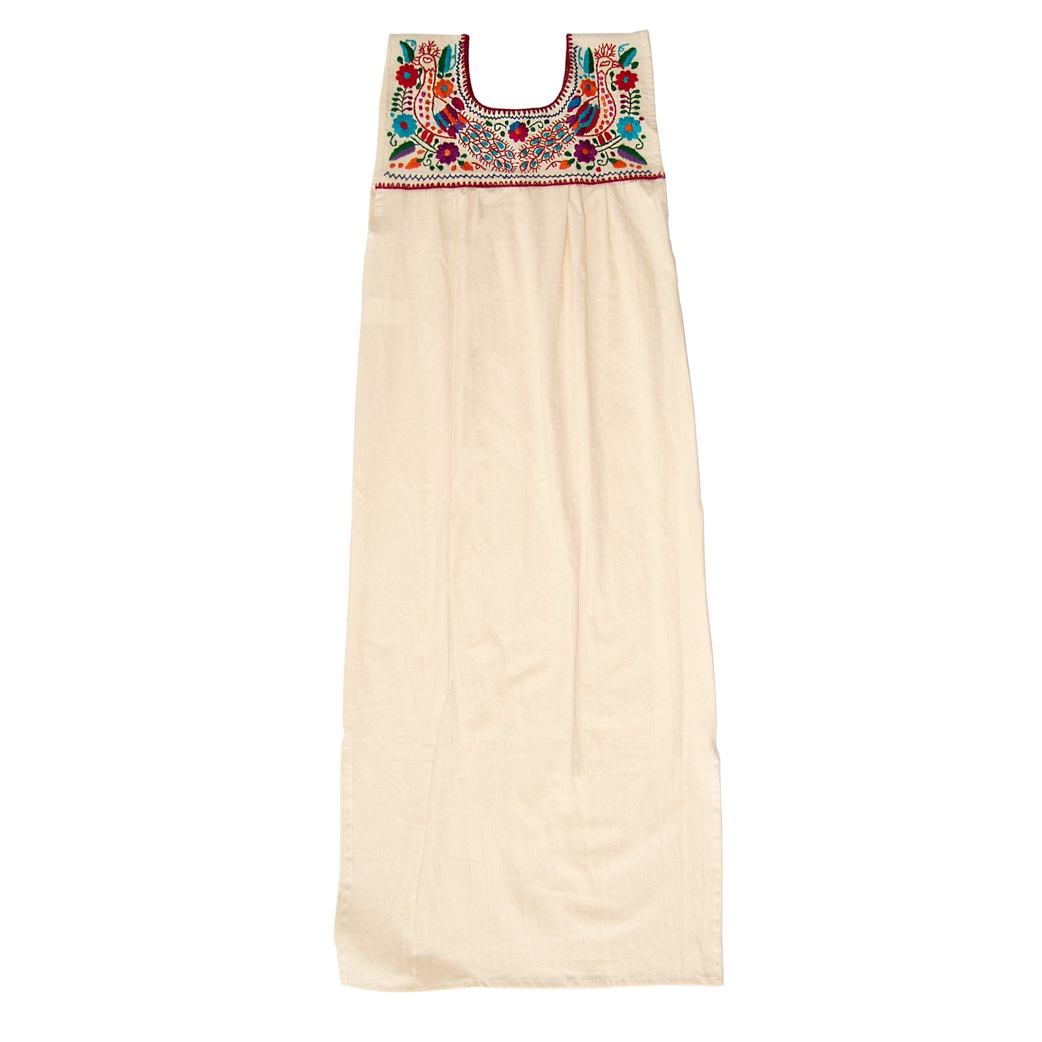 White Maxi Isidra Mexican embroidered dress for women, featuring colorful traditional embroidery and flowing fabric.