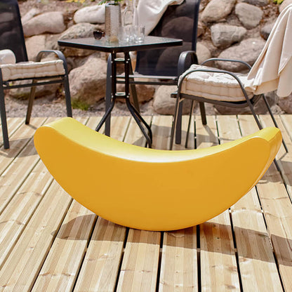 Blush Apricot banana-shaped furniture piece with smooth yellow finish, designed for playful and modern interior decor.