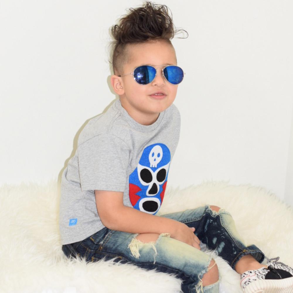 Kids blue luchador T-shirt by Sky Blue Milo featuring a colorful wrestling mask design on soft fabric.