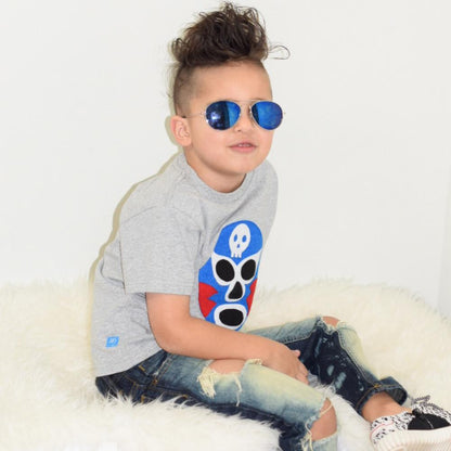 Kids blue luchador T-shirt by Sky Blue Milo featuring a colorful wrestling mask design on soft fabric.