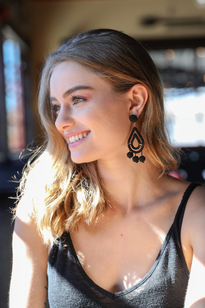 Black micro bead dangle earrings by Periwinkle Aether, featuring delicate, tiny beads hanging in a stylish accessory design.