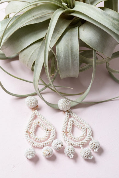 Periwinkle Aether micro bead dangle earrings with colorful tiny beads hanging from silver hooks, showcasing a delicate accessory design.