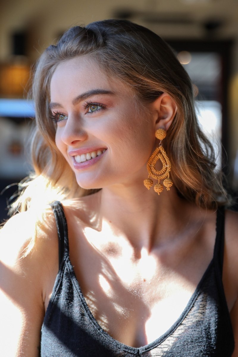 Periwinkle Aether Micro Bead Dangle Earrings in mustard color, featuring small beaded accents and a delicate hanging design.